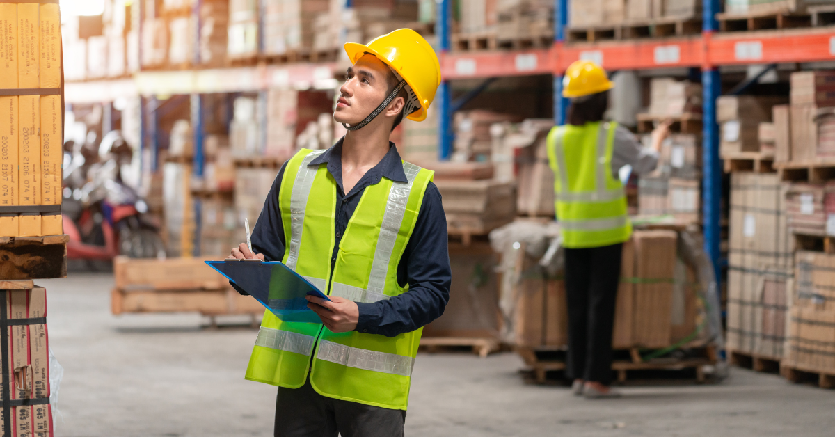 A warehouse employee searching for an asset.